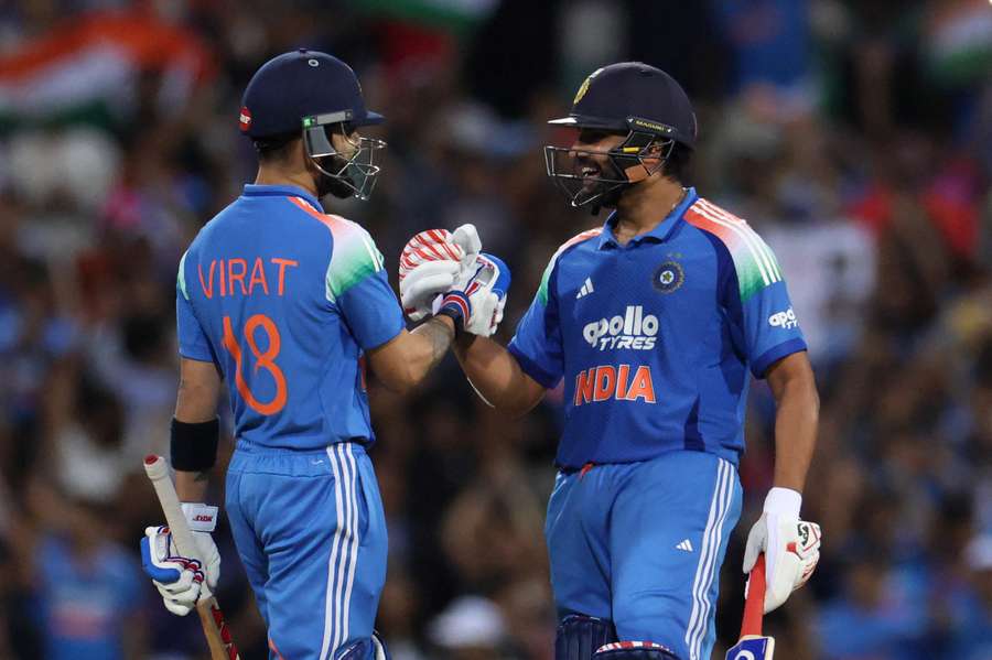 India's Rohit Sharma (right) and Virat Kohli celebrate India's Rohit Sharma (right) and Virat Kohli celebrate