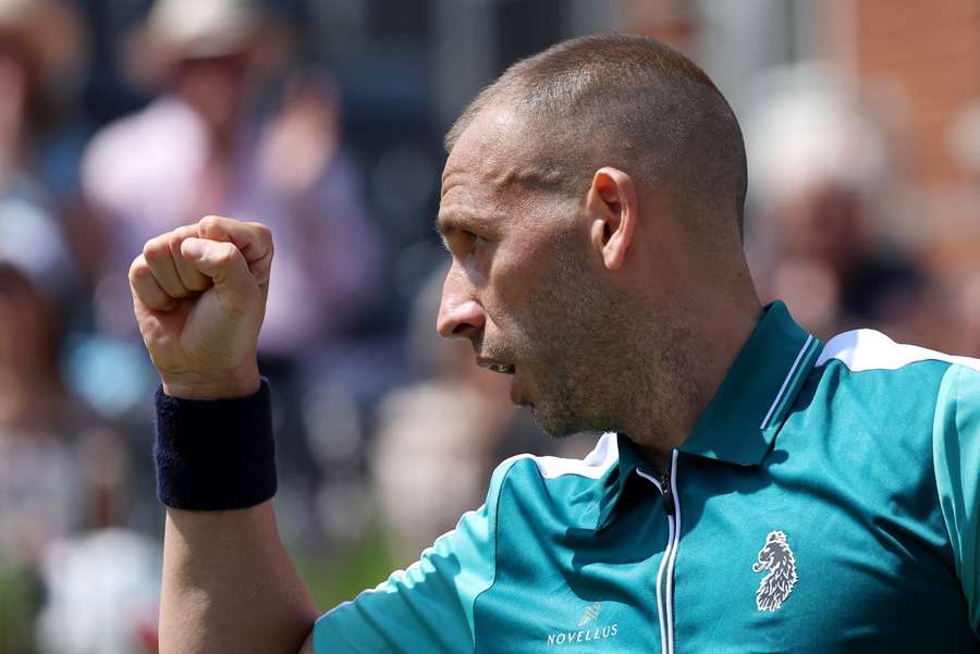 Dan Evans celebrates against Frances Tiafoe