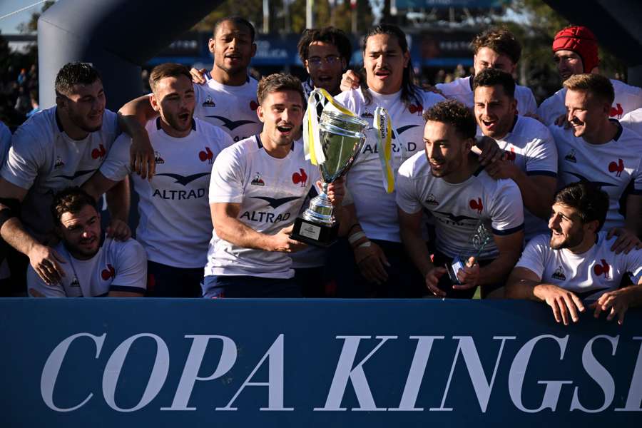 Couilloud lifts the trophy after beating Uruguay