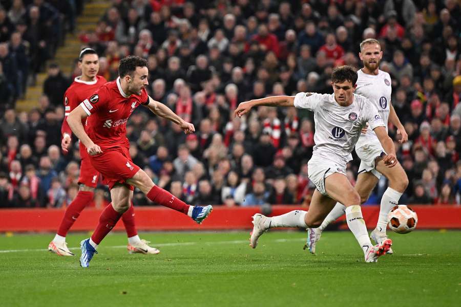 Liverpool's Portuguese striker #20 Diogo Jota scores the opening goal