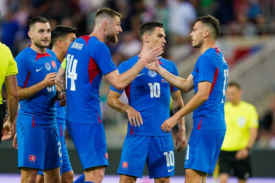 Slovakia players celebrate their team's victory against Wales in a recent friendly