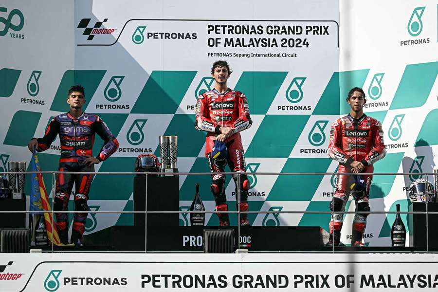 Bagnaia (C) on the podium in Malaysia