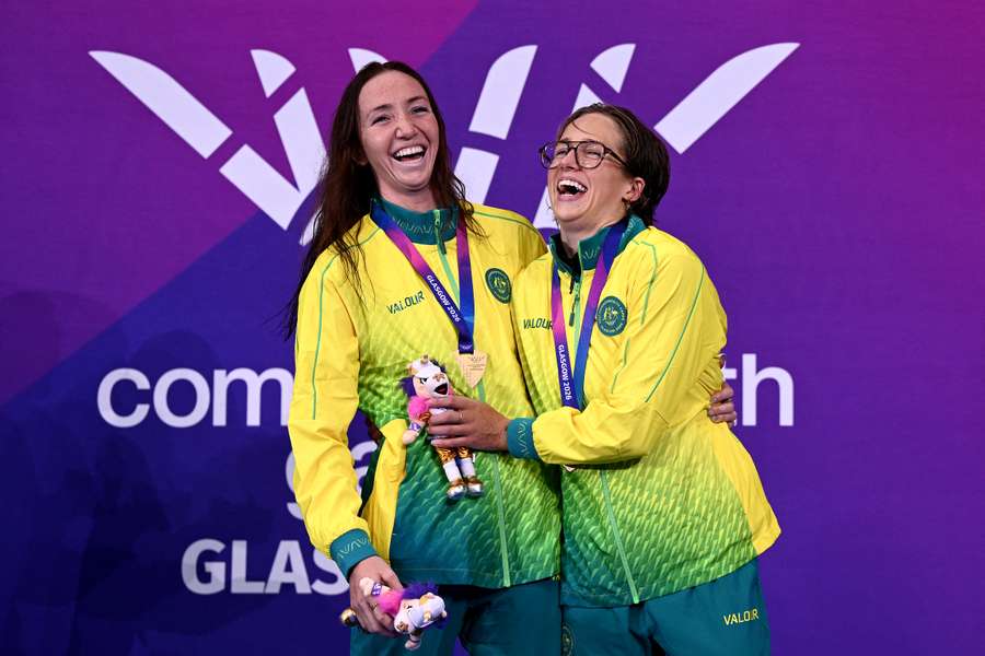 Lani Pallister and Jenna Forrester celebrate their swimming medals won on Day 1 in Glasgow. Lani Pallister and Jenna Forrester celebrate their swimming medals won on Day 1 in Glasgow.