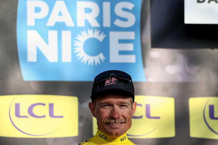 EF Education-EasyPost's Danish rider Magnus Cort Nielsen celebrates on the podium wearing the overall leader's yellow jersey 