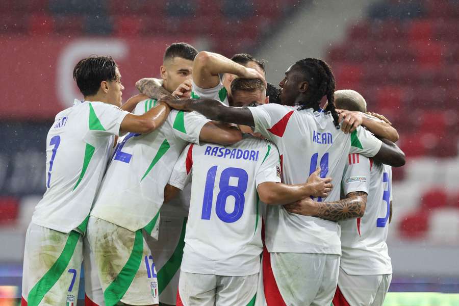 Italy players celebrate scoring against Israel