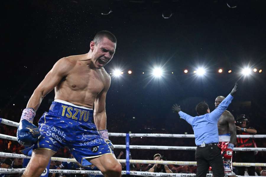 Tszyu celebrates winning the WBO super welterweight title