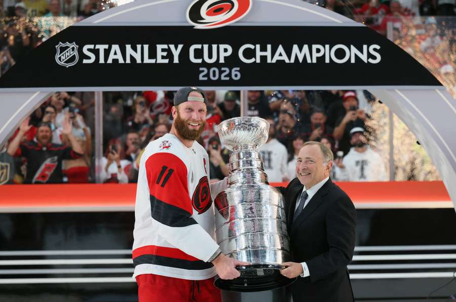 Hurricanes captain Jordan Staal with the Stanley Cup and Commissioner Gary Bettman.