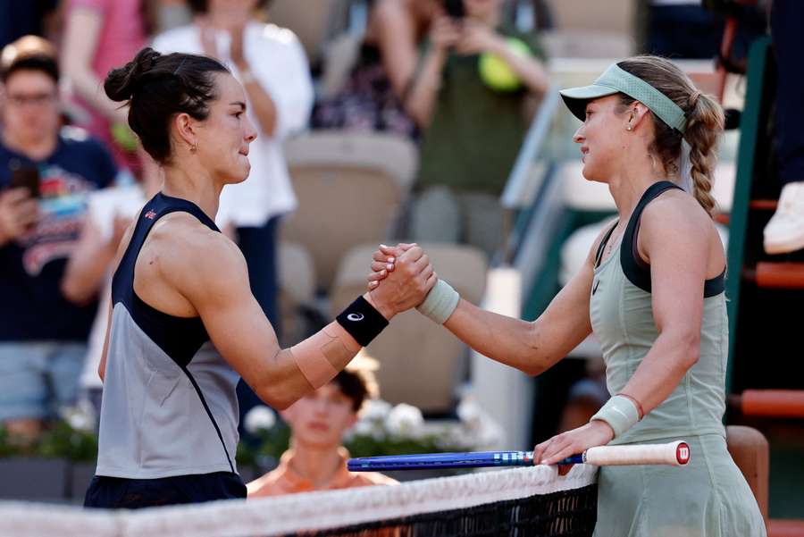 Anna Kalinskaya (R) and Lois Boisson shake hands at the net Anna Kalinskaya (R) and Lois Boisson shake hands at the net