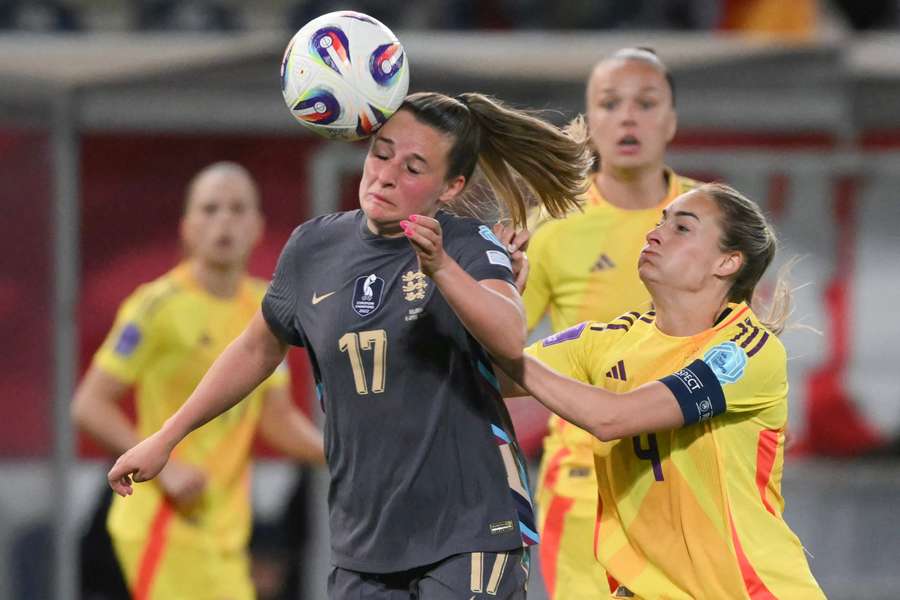 England's forward #17 Ella Toone (L) is tackled by Belgium's forward #09 Tessa Wullaert (R) 