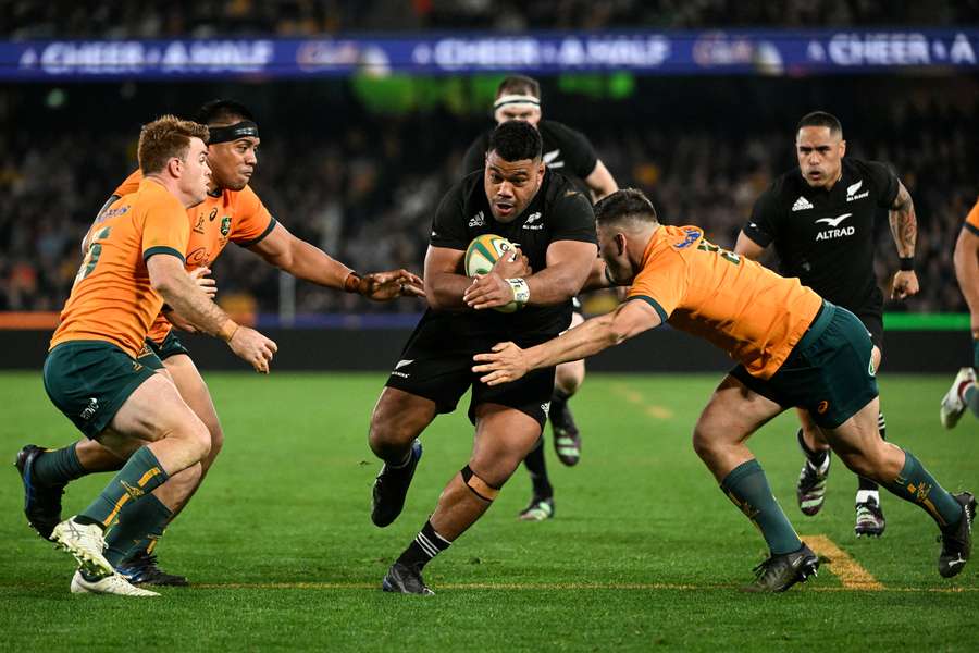 New Zealand's Samisoni Taukeiaho (C) is tackled in their Rugby Championship match against Australia.