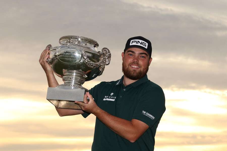 Dan Bradbury poses with the trophy after winning the Open de France