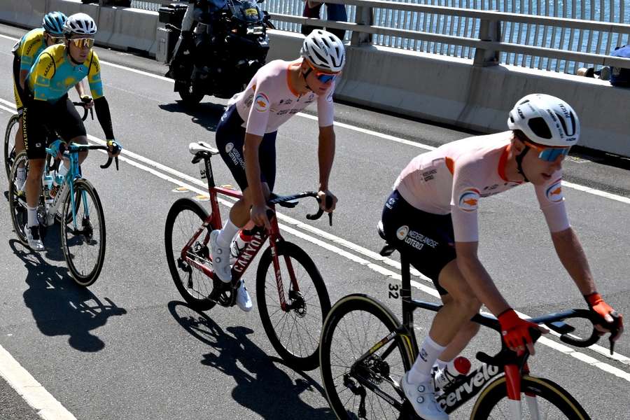 Van der Poel (C) competes in the men's road race cycling event