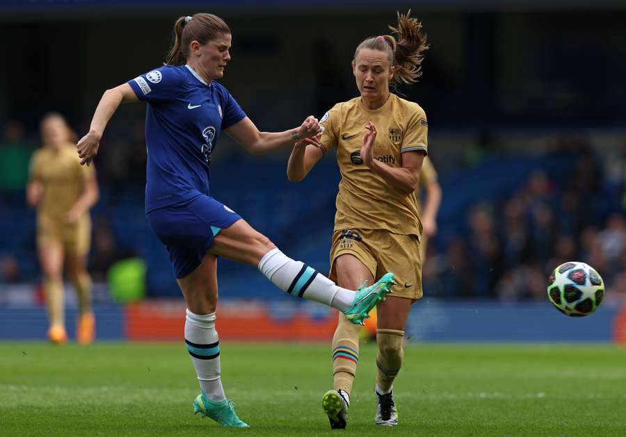 Chelsea midfielder Maren Mjelde (L) vies with Barcelona forward Caroline Hansen