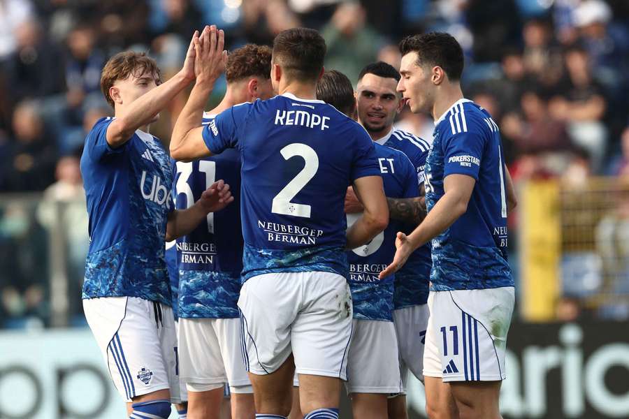 Como's players celebrate a goal
