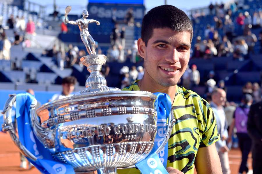 Spain's Carlos Alcaraz poses with his trophy after beating Greece's Stefanos Tsitsipas 