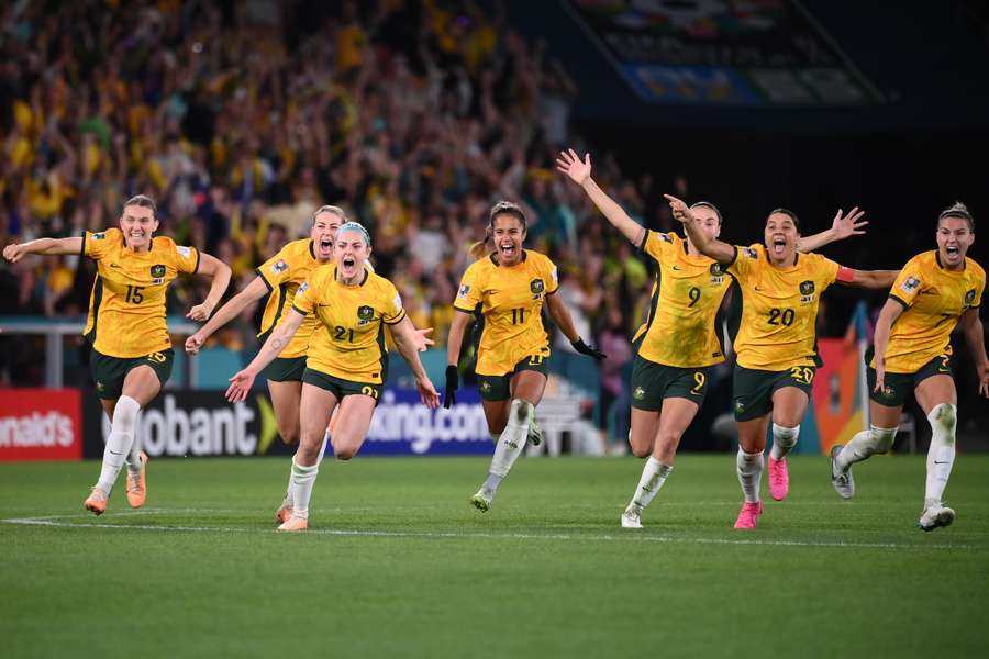 Australia's players celebrate wildly after reaching the Women's World Cup semi-finals