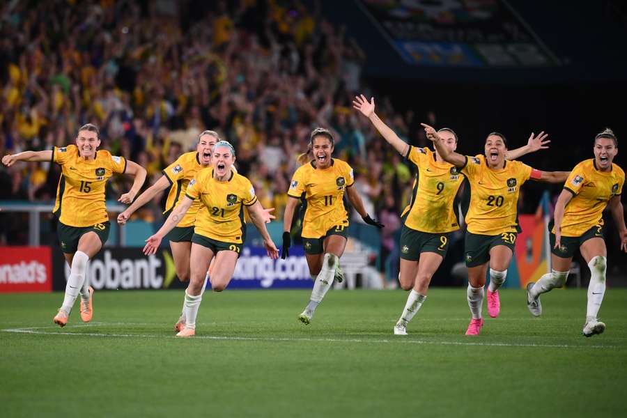 Australia's players celebrate wildly after reaching the Women's World Cup semi-finals