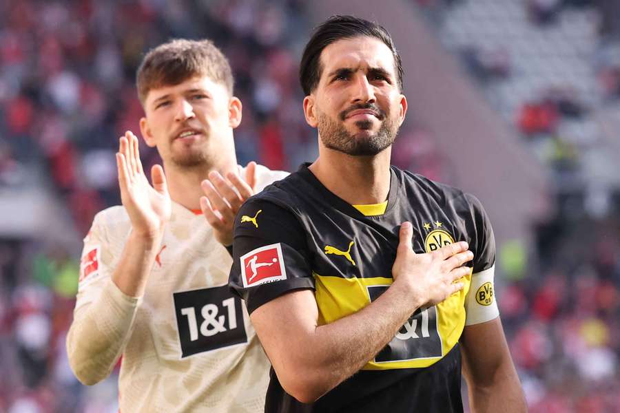 Gregor Kobel (izq.) y el capitán del BVB Emre Can (dcha.)
