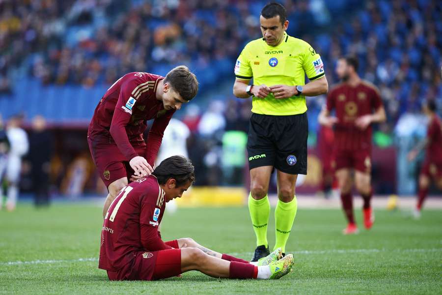 Paulo Dybala of Roma reacts after being injured during the Italian championship Serie A football match between AS Roma and Cagliari