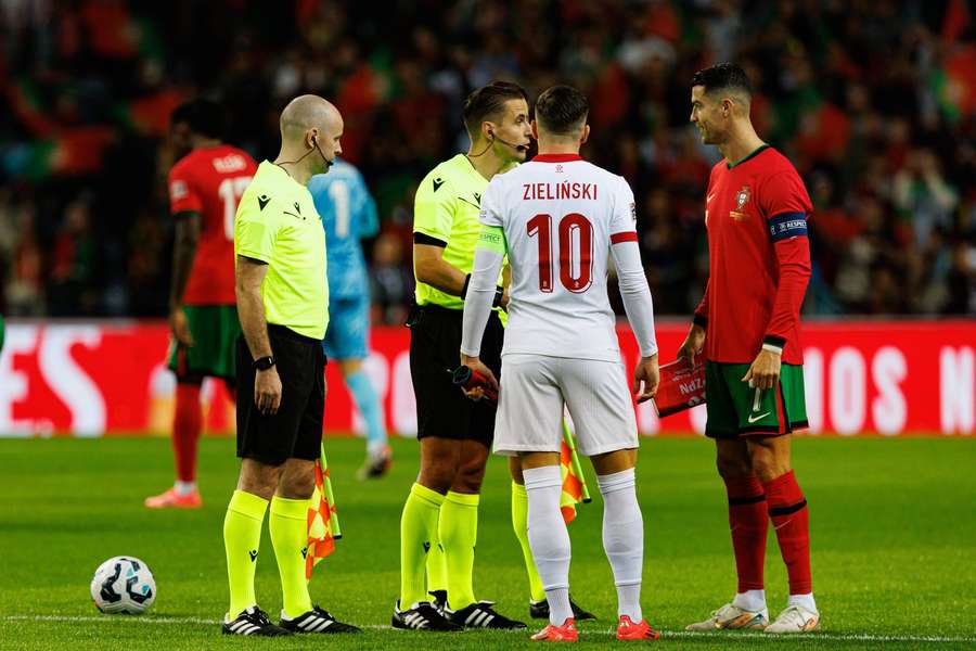 Piotr Zielinski and Cristiano Ronaldo pictured before the game