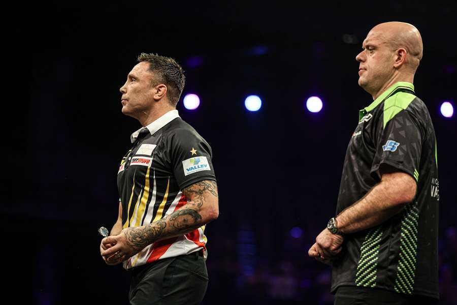 Gerwyn Price (L) and Michael van Gerwen during the Premier League of Darts Night Two final in Antwerp, Belgium