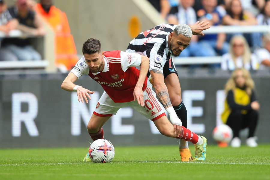 Arsenal's Italian midfielder Jorginho (L) fights for the ball with Newcastle United's Brazilian striker Joelinton