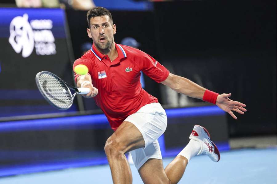 Novak Djokovic hits a return against Zhang Zhizhen during their singles match