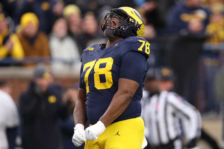 Michigan defensive tackle Kenneth Grant celebrating a sack
