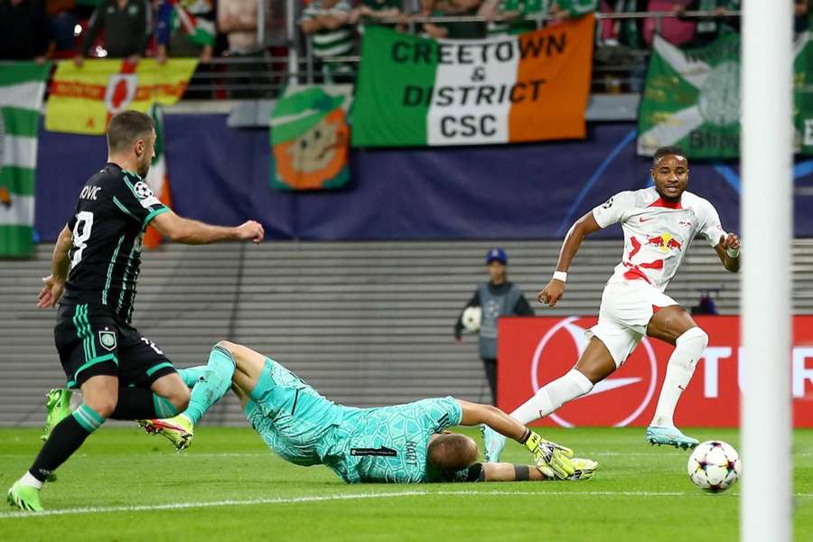 Christopher Nkunku scores the opening goal for RB Leipzig.