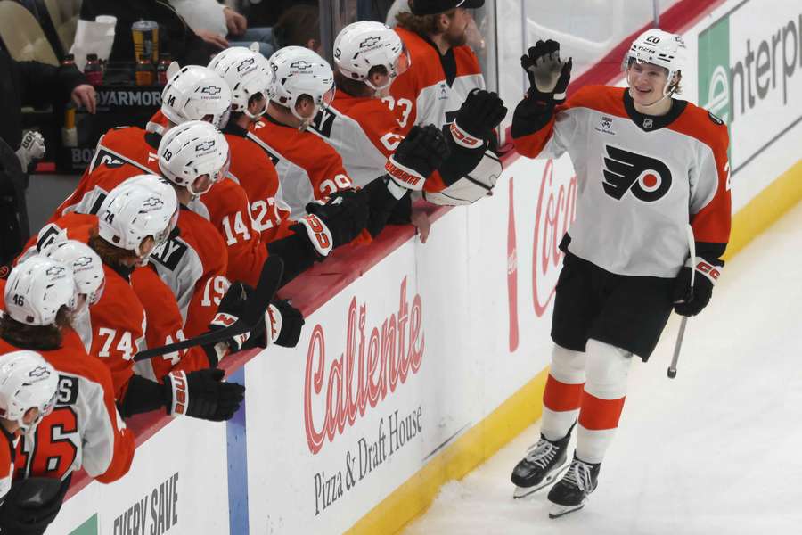 The Philadelphia Flyers celebrate winning a key NHL game over their rivals.