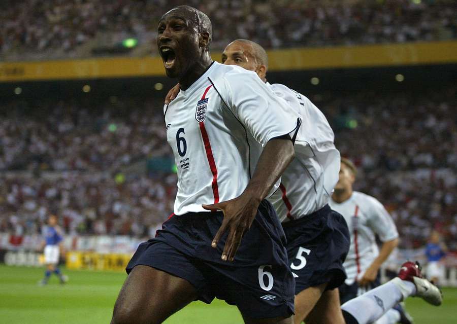 England's defender Sol Campbell (C) shouts out as he celebrates with teammate Rio Ferdinand (R) after scoring the first goal against Sweden during the 2002 FIFA World Cup England's defender Sol Campbell (C) shouts out as he celebrates with teammate Rio Ferdinand (R) after scoring the first goal against Sweden during the 2002 FIFA World Cup