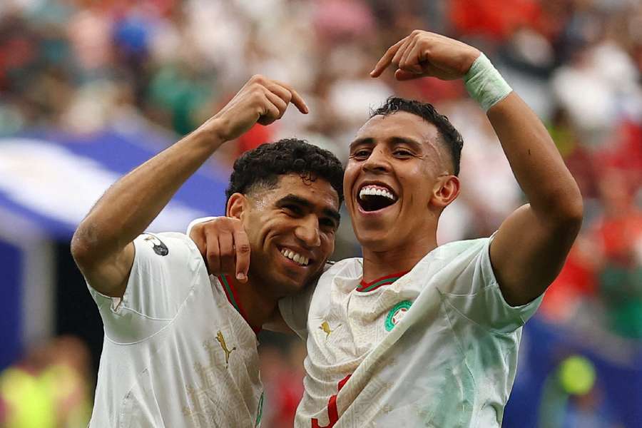Morocco players celebrate together Morocco players celebrate together