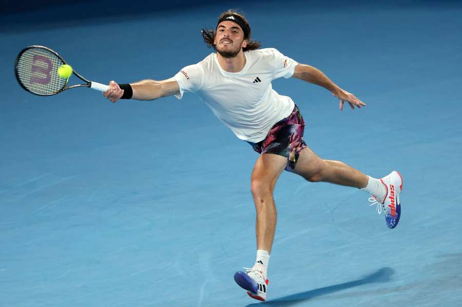 Tsitsipas returning the ball against Jiri Lehecka