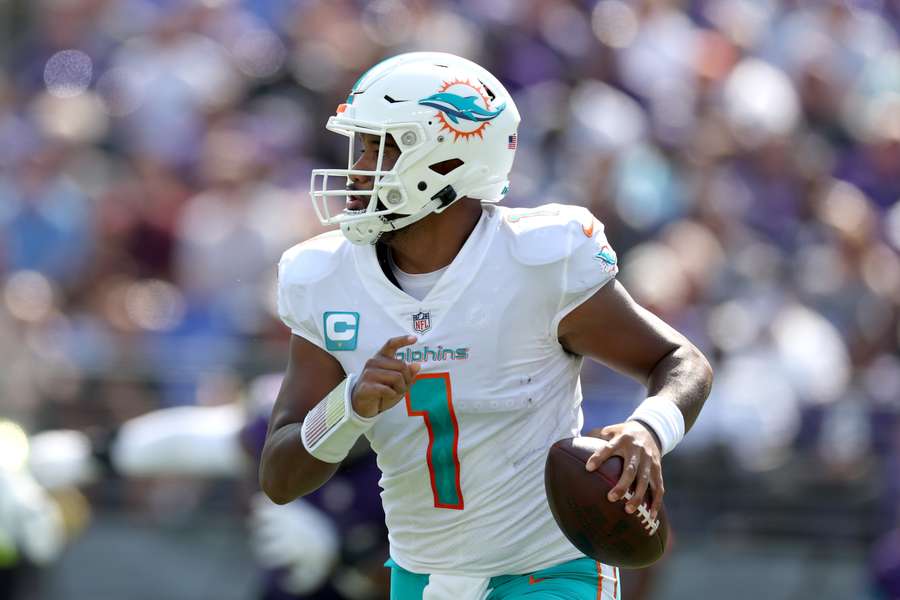 Quarterback Tua Tagovailoa of the Miami Dolphins throws a second half pass against the Baltimore Ravens.