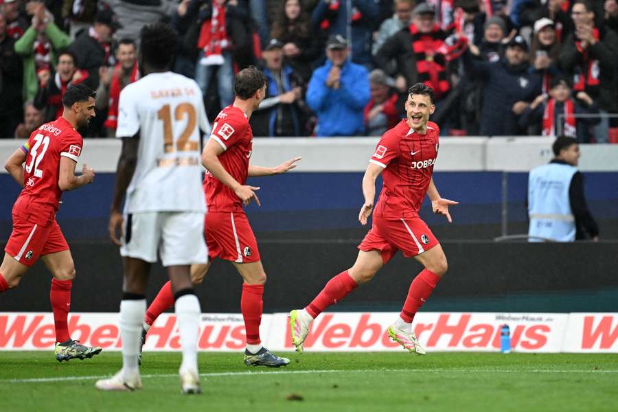 Maximilian Eggestein (right) celebrates scoring Freiburg's first goal