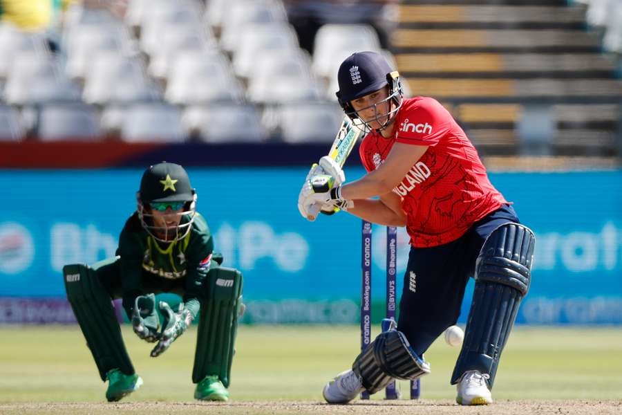 England's Nat Sciver-Brunt (R) plays a shot