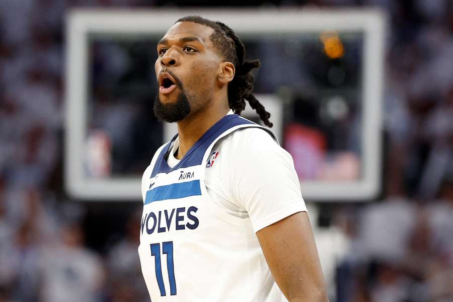 Minnesota Timberwolves and Naz Reid reacts after making a three-point shot against the Denver Nuggets (2024)