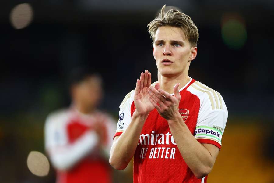 Odegaard of Arsenal claps the fans at full-time