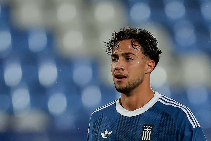 Kōstoulas in a Greece shirt Kōstoulas in a Greece shirt