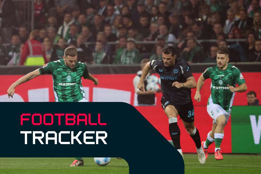 Bremen's forward Marvin Ducksch vies for the ball with Bayer Leverkusen's Granit Xhaka