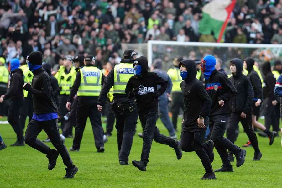 Rangers fans invading the pitch at Ibrox Rangers fans invading the pitch at Ibrox