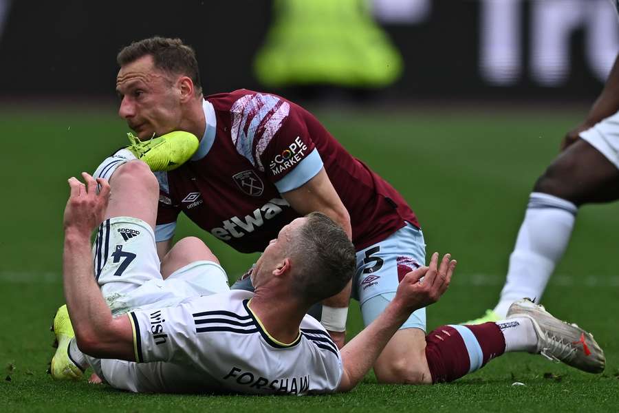 Leeds United's English midfielder Adam Forshaw (L) and West Ham United's Czech defender Vladimir Coufal have an accidental collision during the English Premier League football match between West Ham United and Leeds United