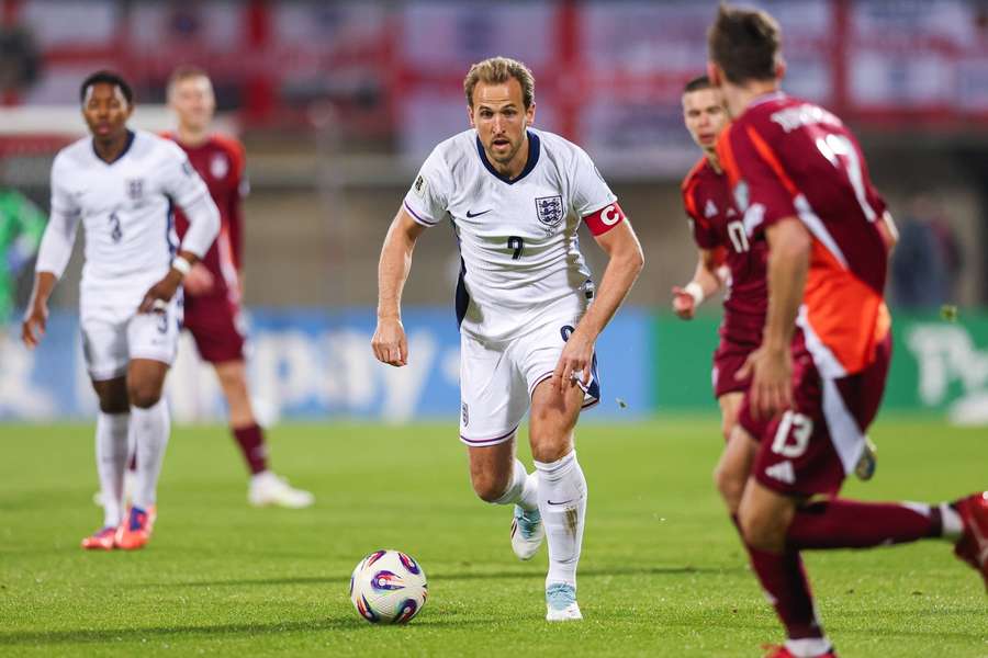 England's Harry Kane bears down on the Latvian defence in their World Cup qualifier