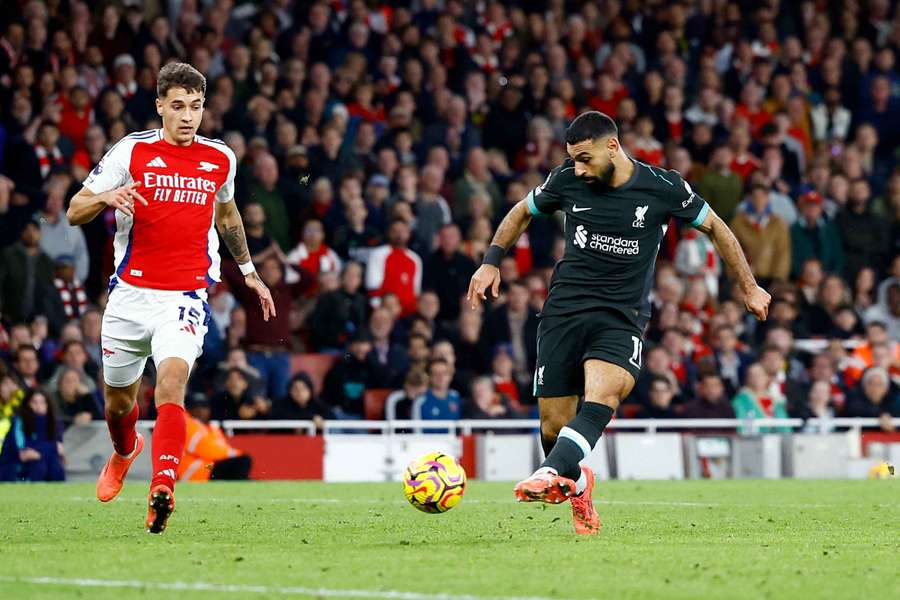 Liverpool's Mohamed Salah scoring against Arsenal