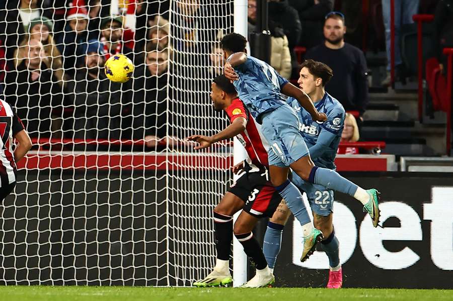 Aston Villa's English striker #11 Ollie Watkins (C) heads home their second goal