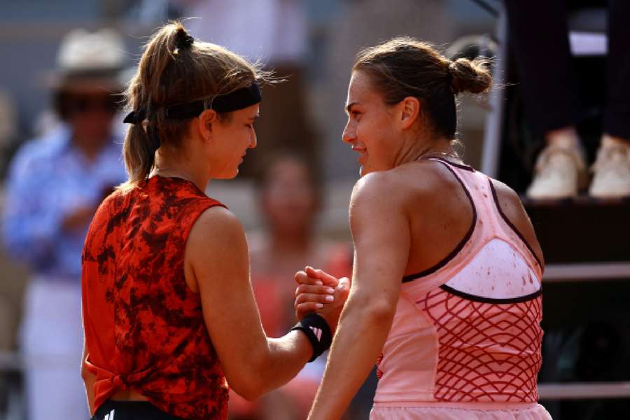 Muchova and Sabalenka meet at the net after the match