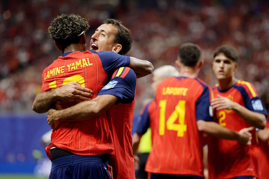 Spain's Lamine Yamal celebrates scoring their first goal with Mikel Oyarzabal Spain's Lamine Yamal celebrates scoring their first goal with Mikel Oyarzabal