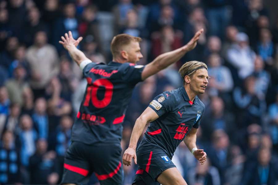 Jens Stryger Larsen (background) celebrates his winner for Malmo at Djurgarden