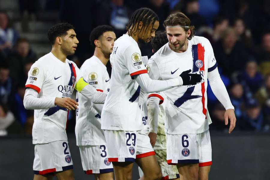 Paris Saint-Germain's Bradley Barcola celebrates scoring with Illia Zabarnyi