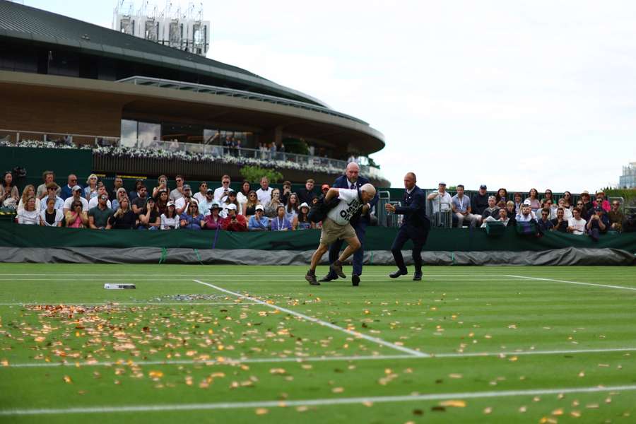 Rain has interrupted day three at Wimbledon more than the protest